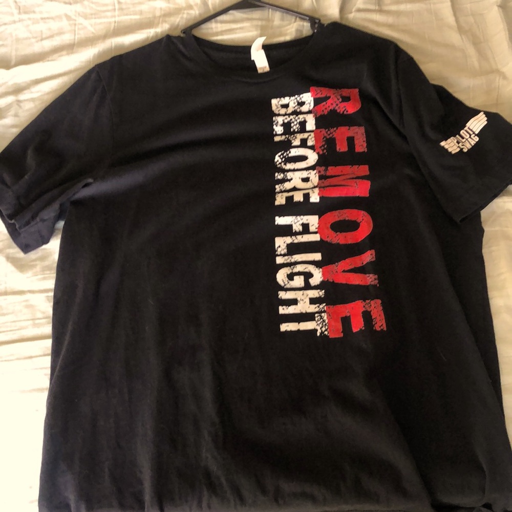 Pilot swag black T-shirt remove before flight